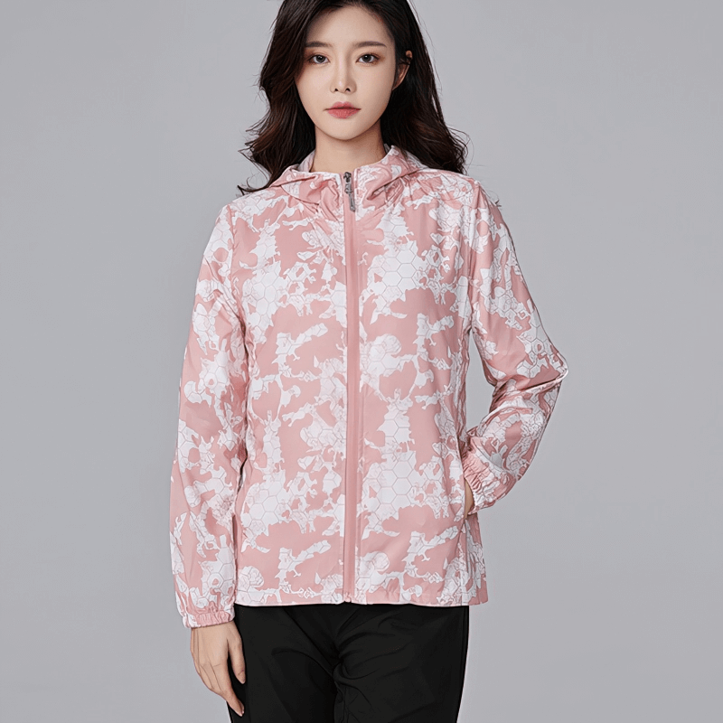 Pink floral sun-protective waterproof women's windbreaker jacket with hood and zipper, ideal for outdoor activities.